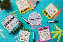 Load image into Gallery viewer, Four sets of bingo cards and erasable markers around a spinning wheel with bingo card graphics