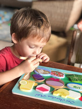 Load image into Gallery viewer, Boy playing with Hawaiian plate food puzzle Keiki Kaukau