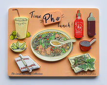 Load image into Gallery viewer, Pastel orange Vietnamese wooden food puzzle reading "Time Pho lunch" with 9 different puzzle pieces (kalamansi drink, limes, chopstick on a napkin, bowl of pho with soup spoon, siracha bottle, hoisin bottle, chili oil container, and basil)