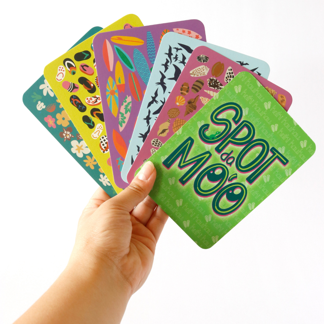 Hand holding 6 Spot da Mo‘o cards fanned out