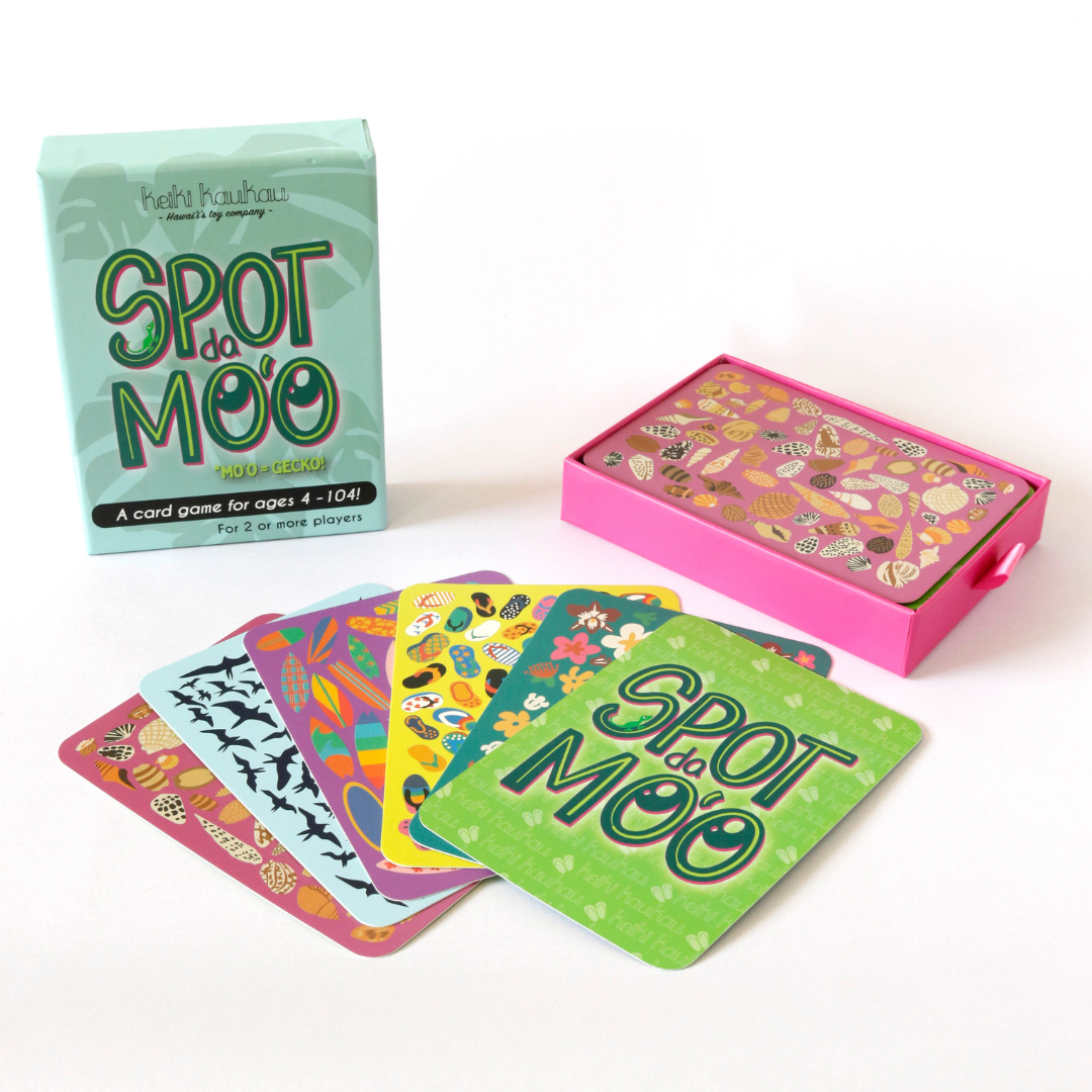 5 different Spot da Mo‘o cards in front of Spot da Mo‘o box packaing