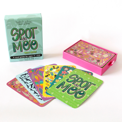 5 different Spot da Mo‘o cards in front of Spot da Mo‘o box packaing