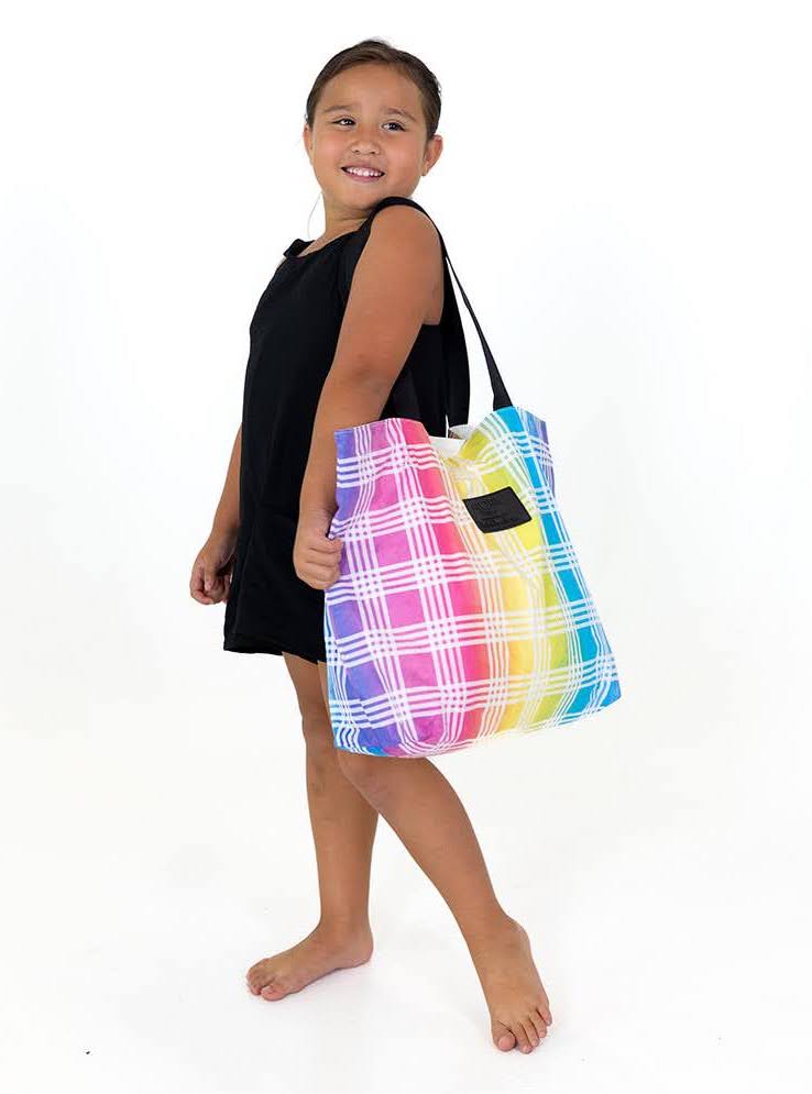 Young girl standing with Aloha Tote