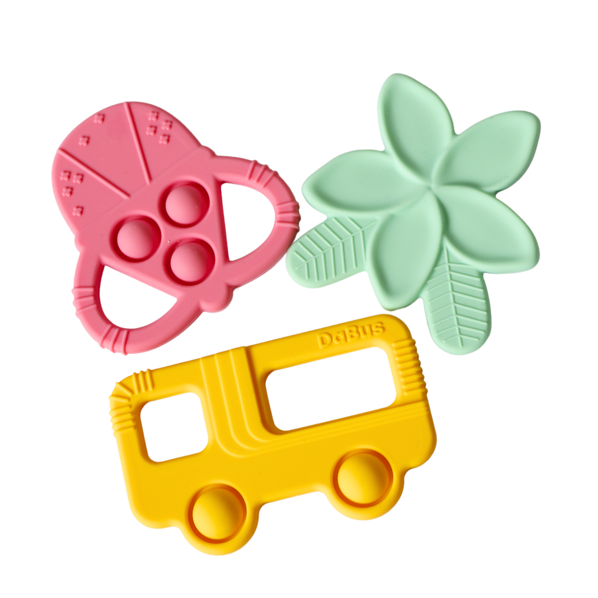 Three silicone teethers: a pink shave ice, teal plumeria flower, and yellow bus