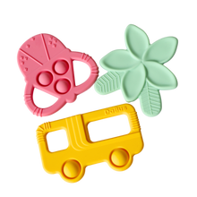 Load image into Gallery viewer, Three silicone teethers: a pink shave ice, teal plumeria flower, and yellow bus