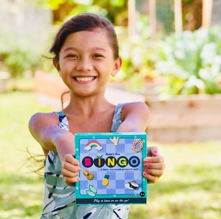 Girl holding teal box reading "Hawai'i Kine BINGO" 