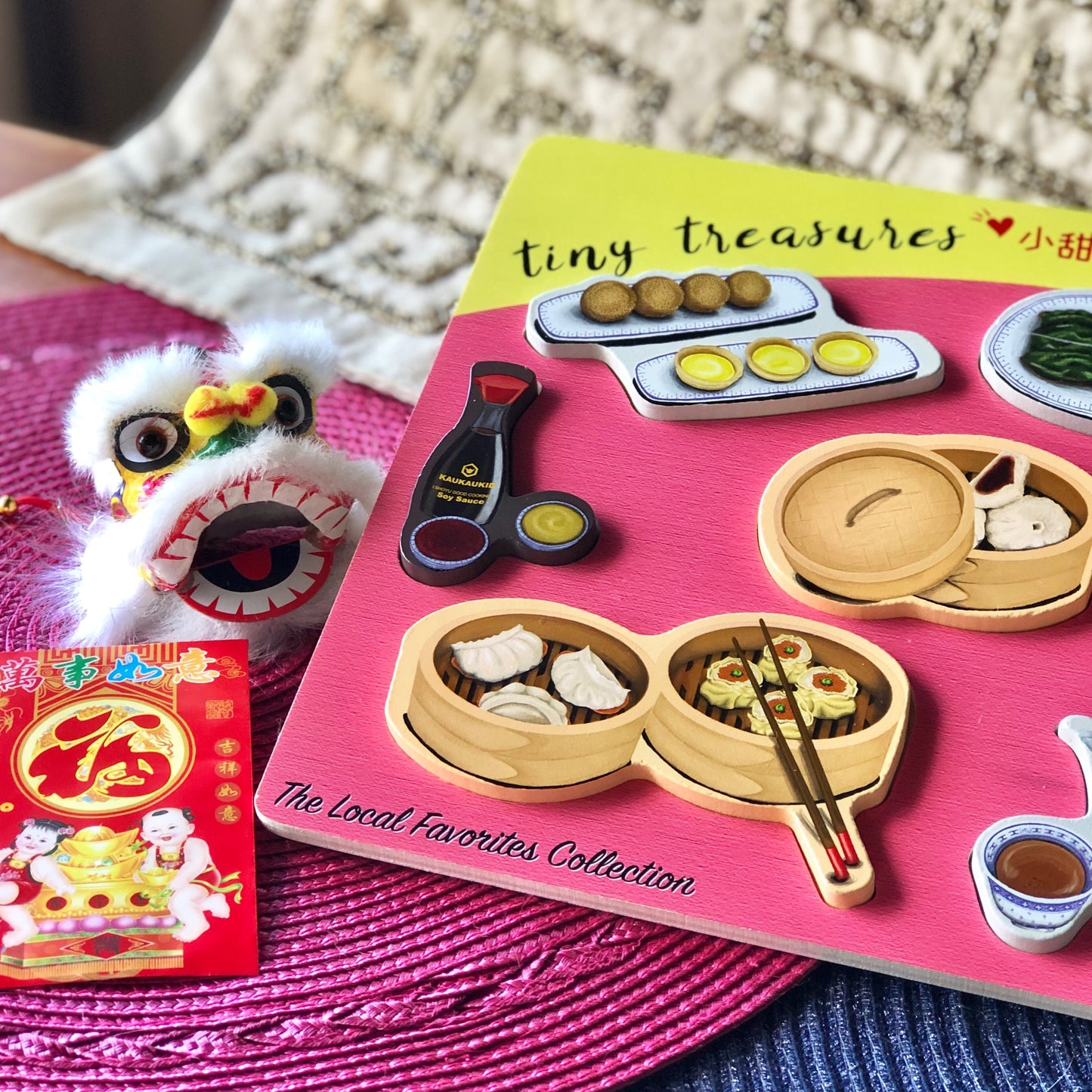 Close-up of Dim sum puzzle pieces (Shoyu bottle, Egg tarts and Jin dui,  Char siu bao, and Dim sum basket)