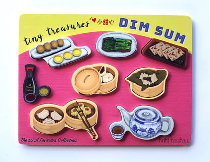 Yelllow and pink dim sum puzzle reading "tiny treasures dim sum" with all pieces in place